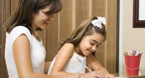 mom and daughter, teaching, learning at home