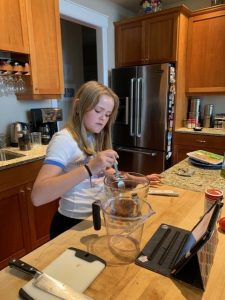Windermom, Kate Hauter cooking with daughter during covid 19, Windermoms Quarantine Activities