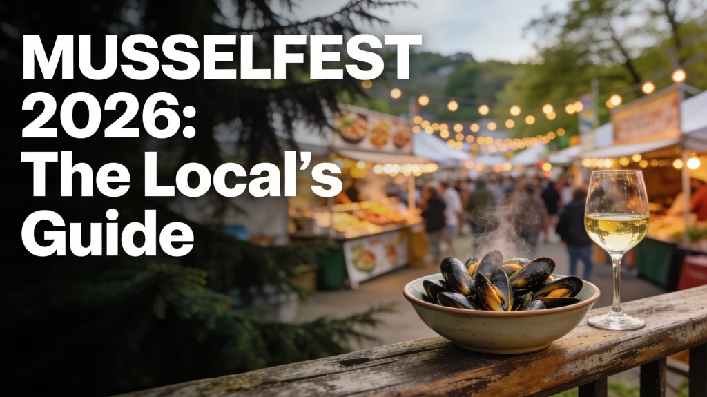 Steaming bowl of mussels on a waterfront railing in Coupeville, Washington during a local festival.